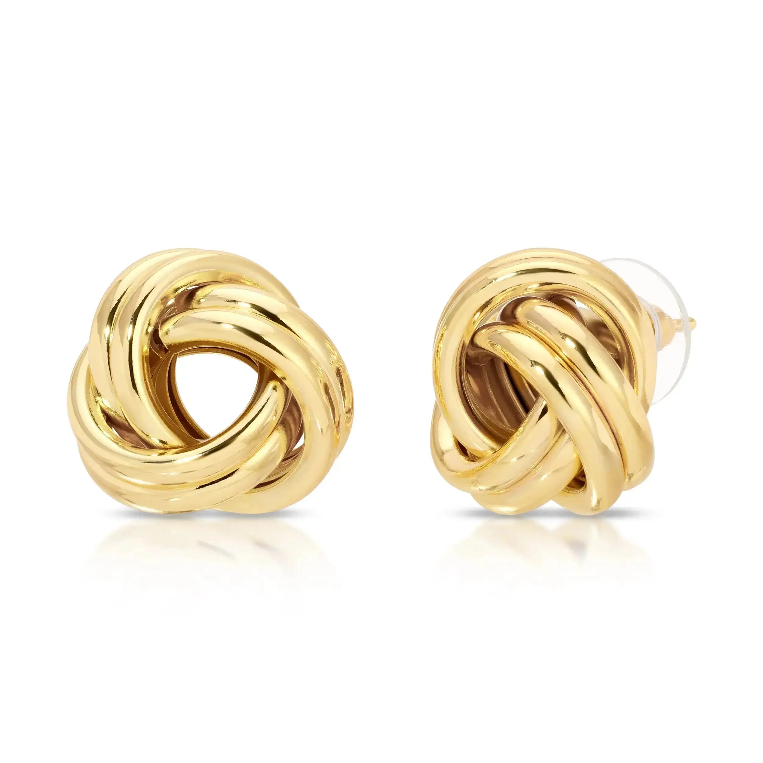 A pair of gold-colored knot earrings with a twisted silhouette, displayed against a white background.